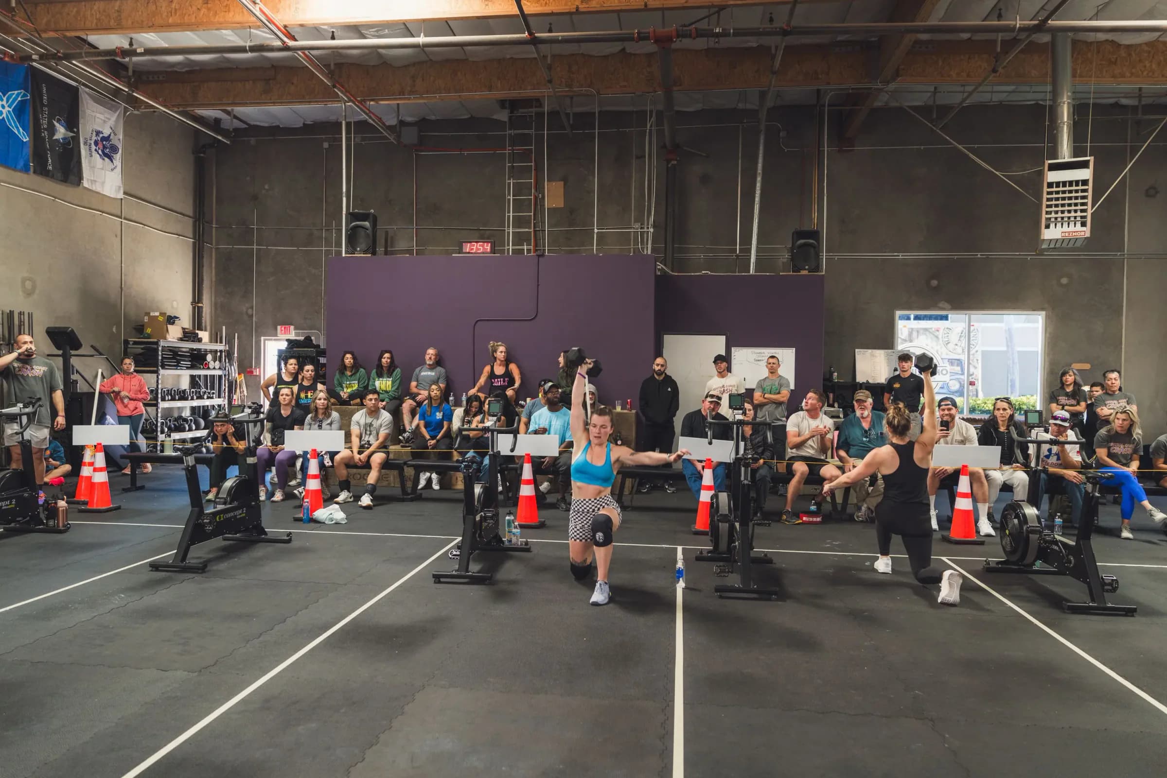 One Life members training with barbells during a coached group session
