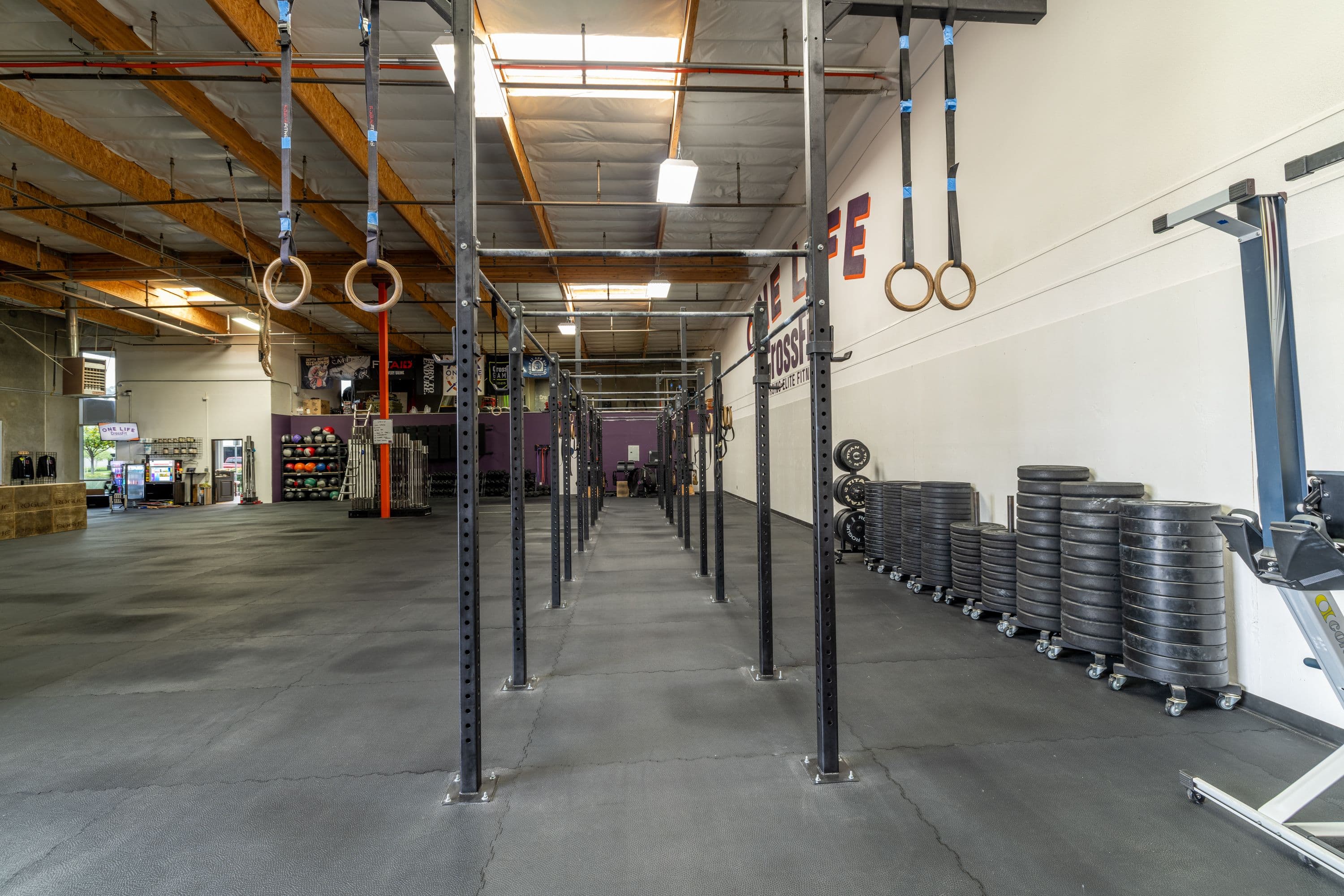 Wide view of the One Life CrossFit training floor and pull-up rig
