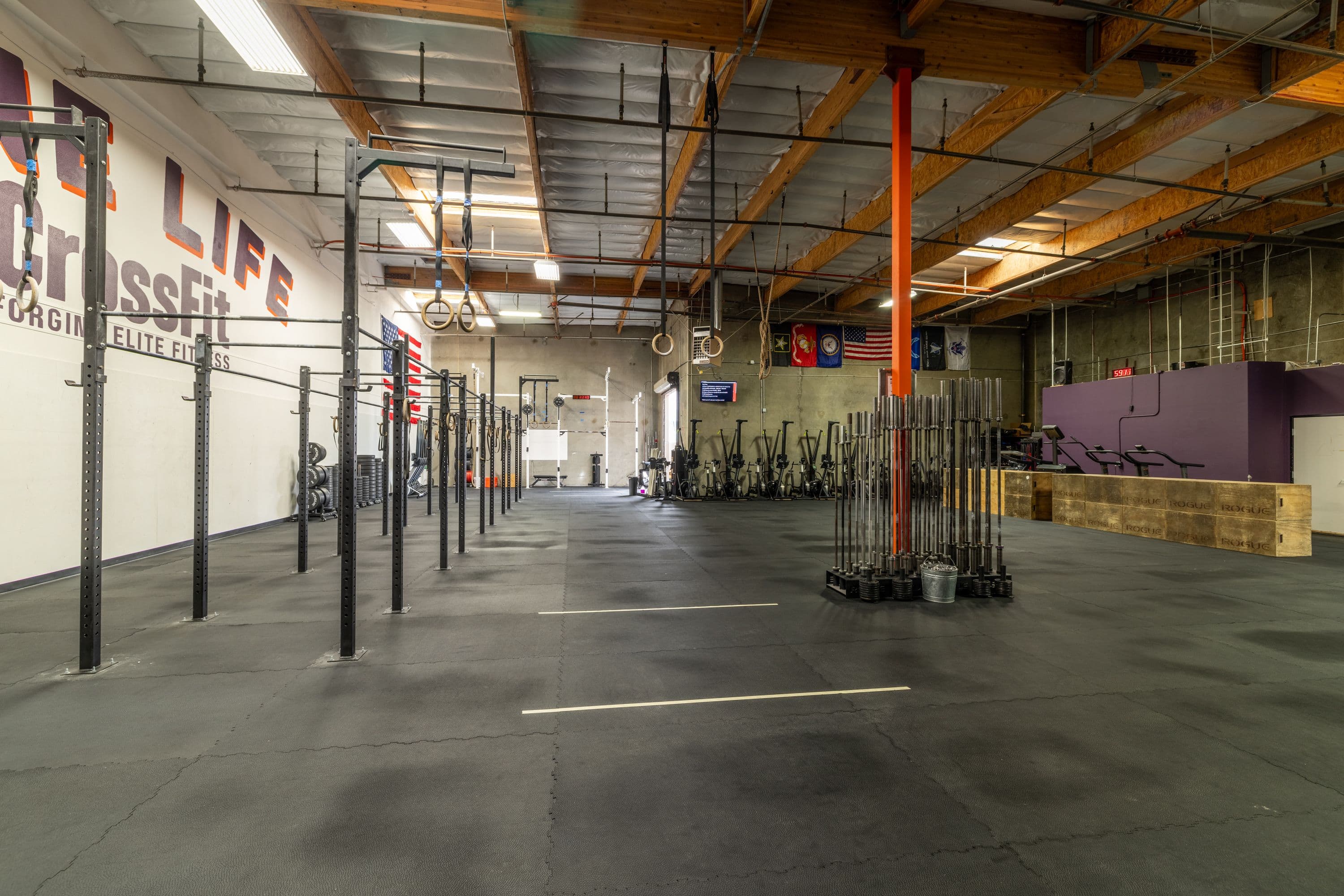 Pull-up stations, rings, and open floor space inside One Life CrossFit